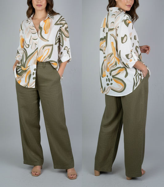 Woman wearing a patterned blouse and green pants, shown from front and back views.